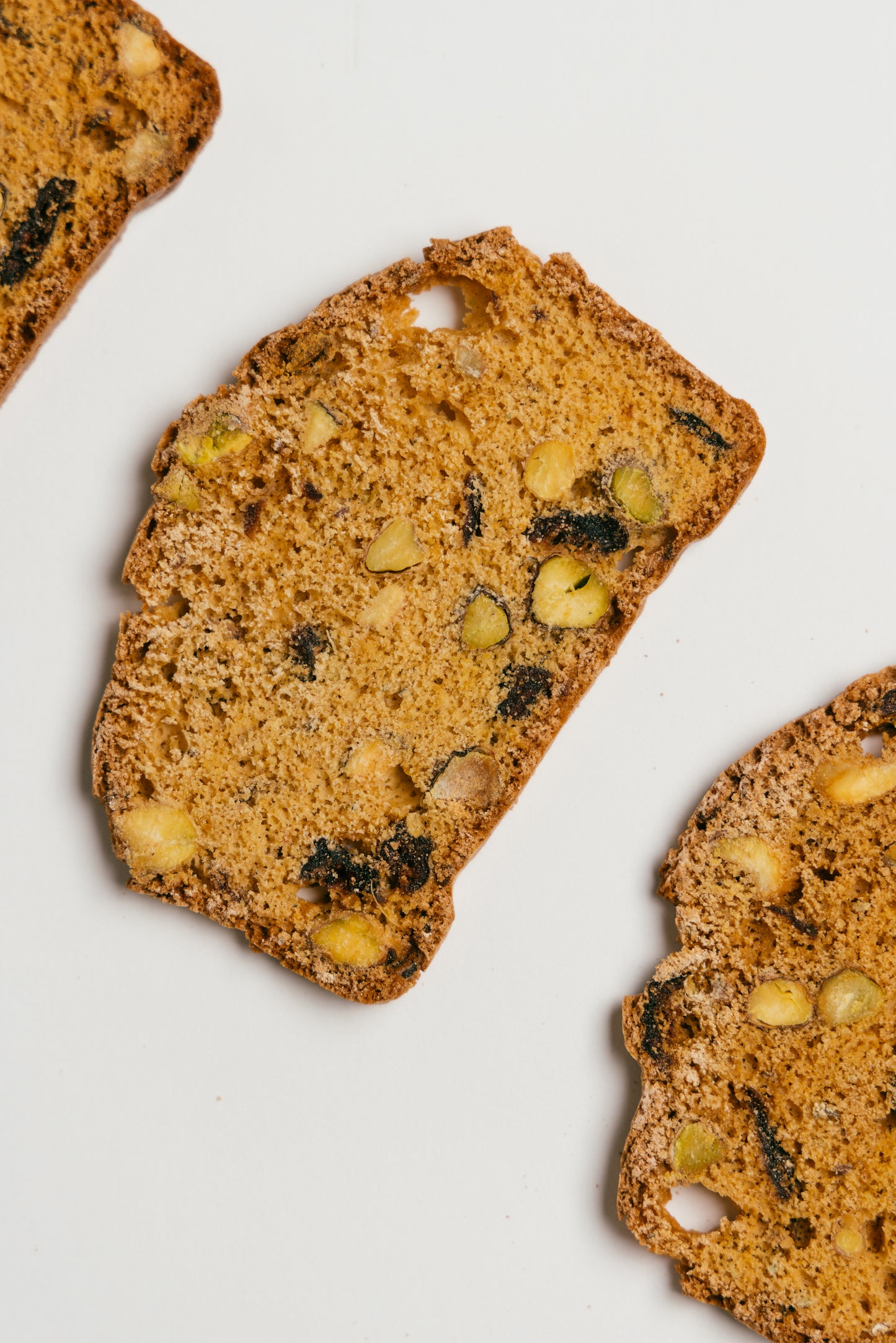 Close-up of Zammo’s Pistachio Cranberry Cardamom Biscotti slices – handcrafted in Hong Kong.